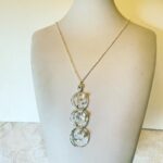 Triple Orbit with Crystal Quartz Necklace